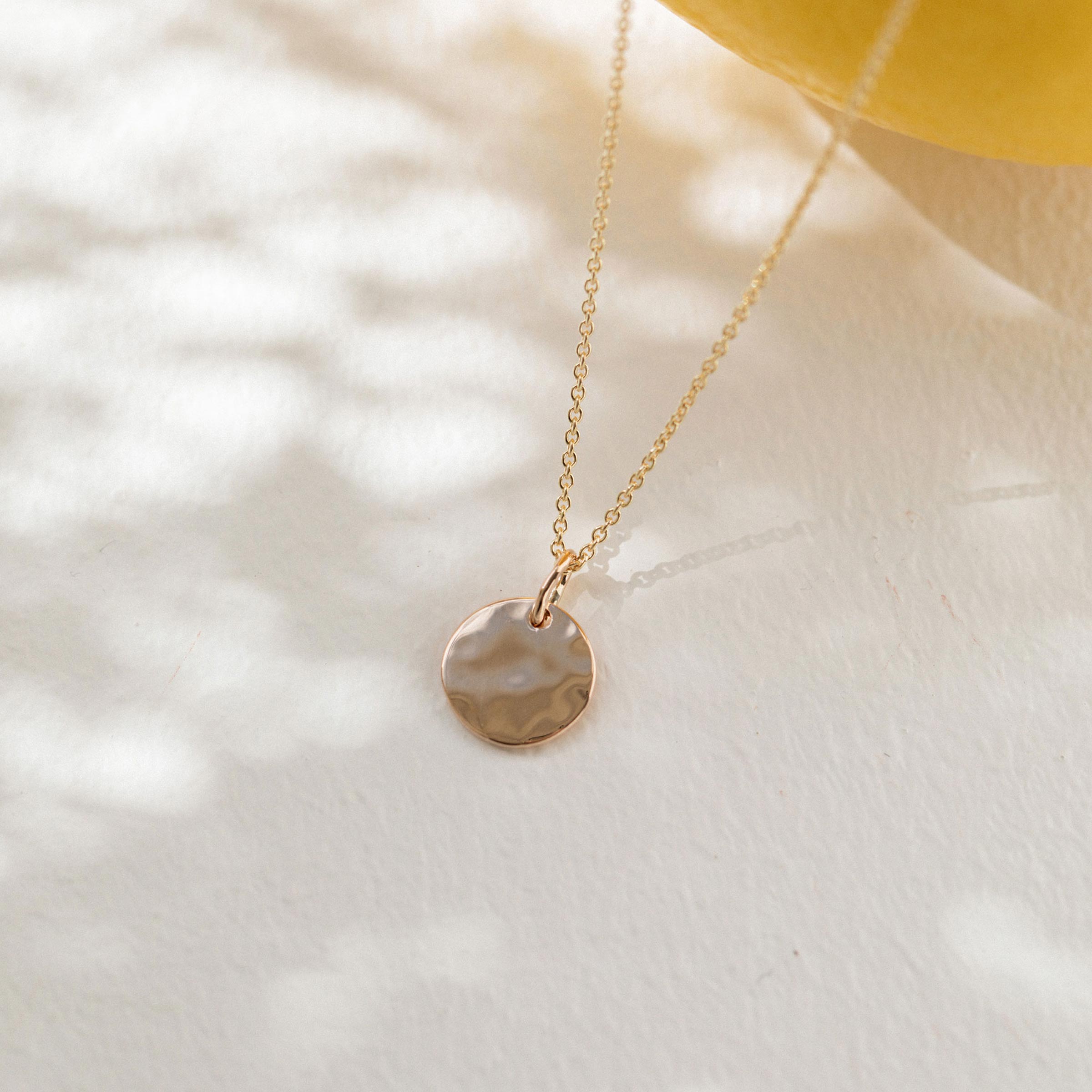 Hammered disk pendant necklace