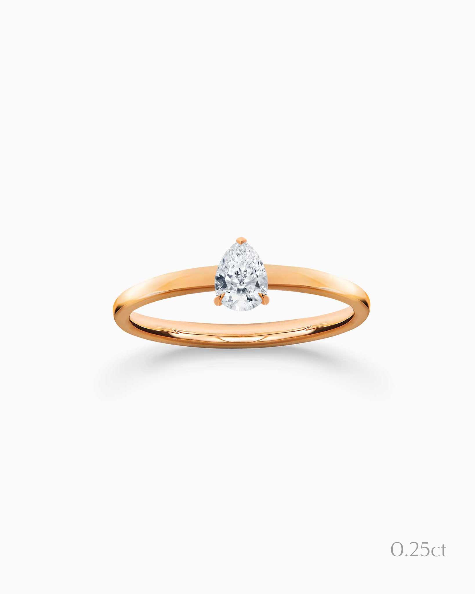 A pear diamond 0.25ct in a yellow gold band