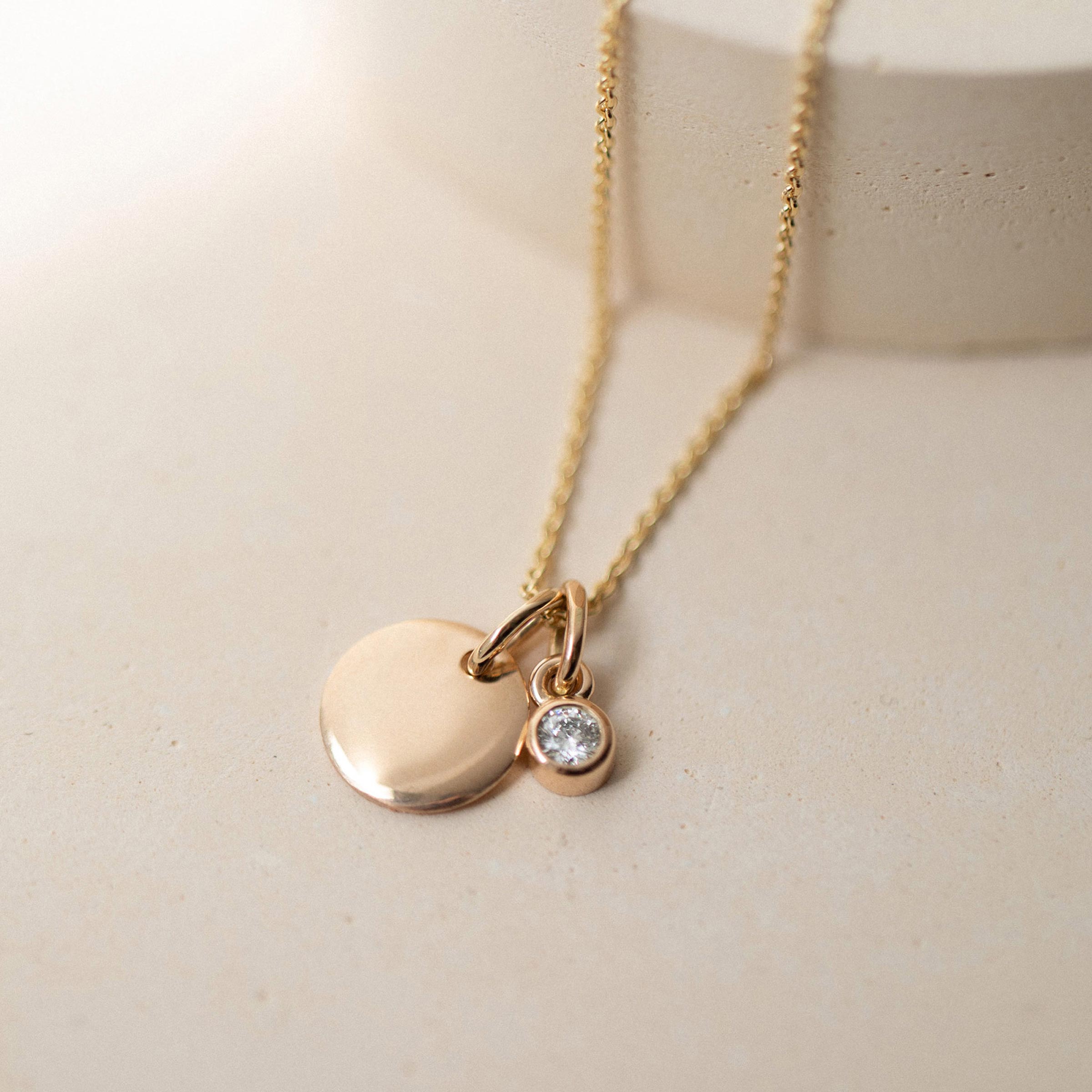 Smooth disk and diamond necklace